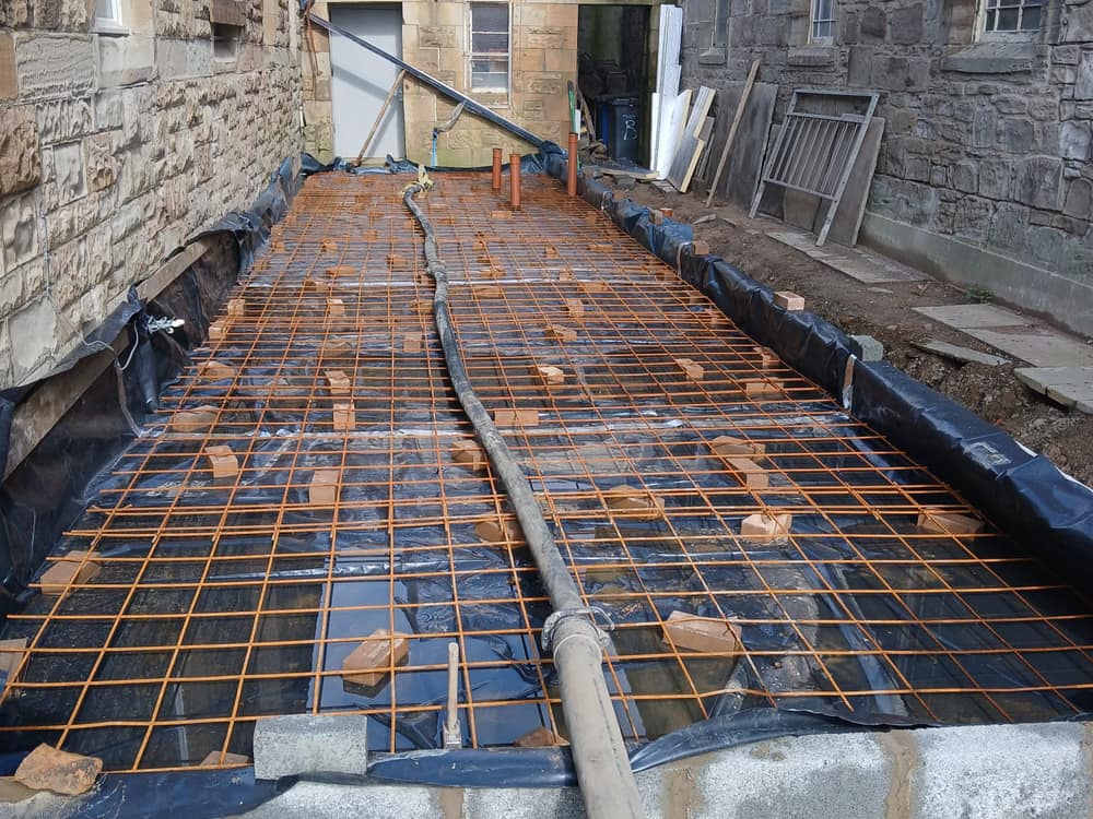 Steel reinforcing mesh and damp-proof membrane laid ready for concrete